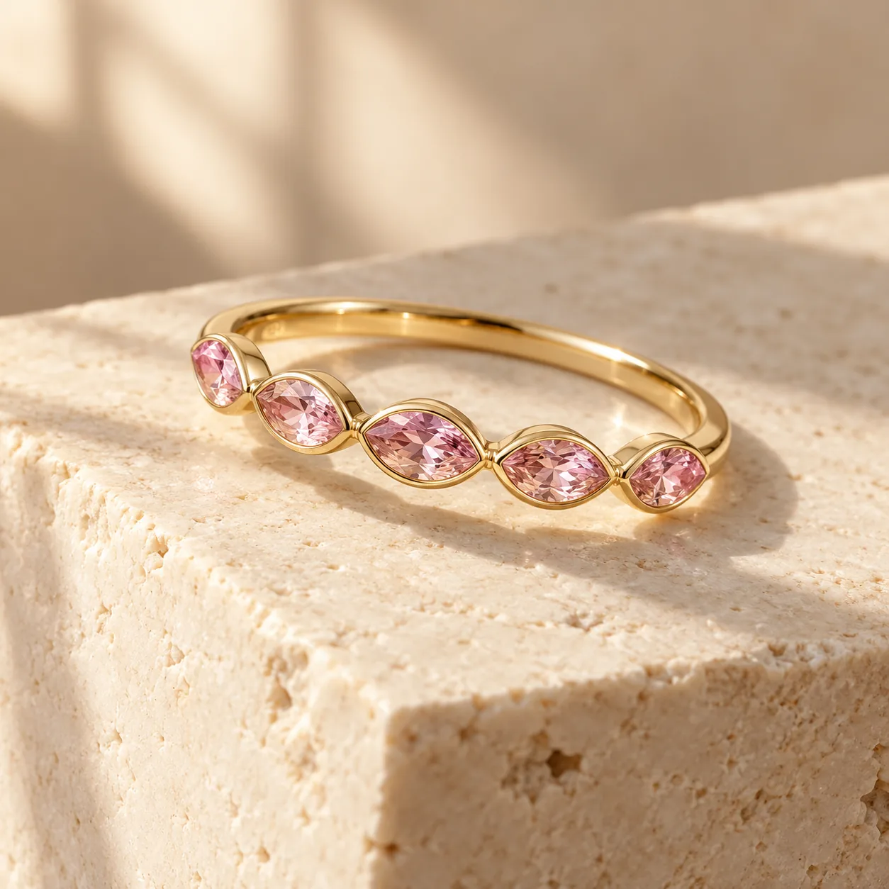 Slim gold band with five small marquise pink sapphires